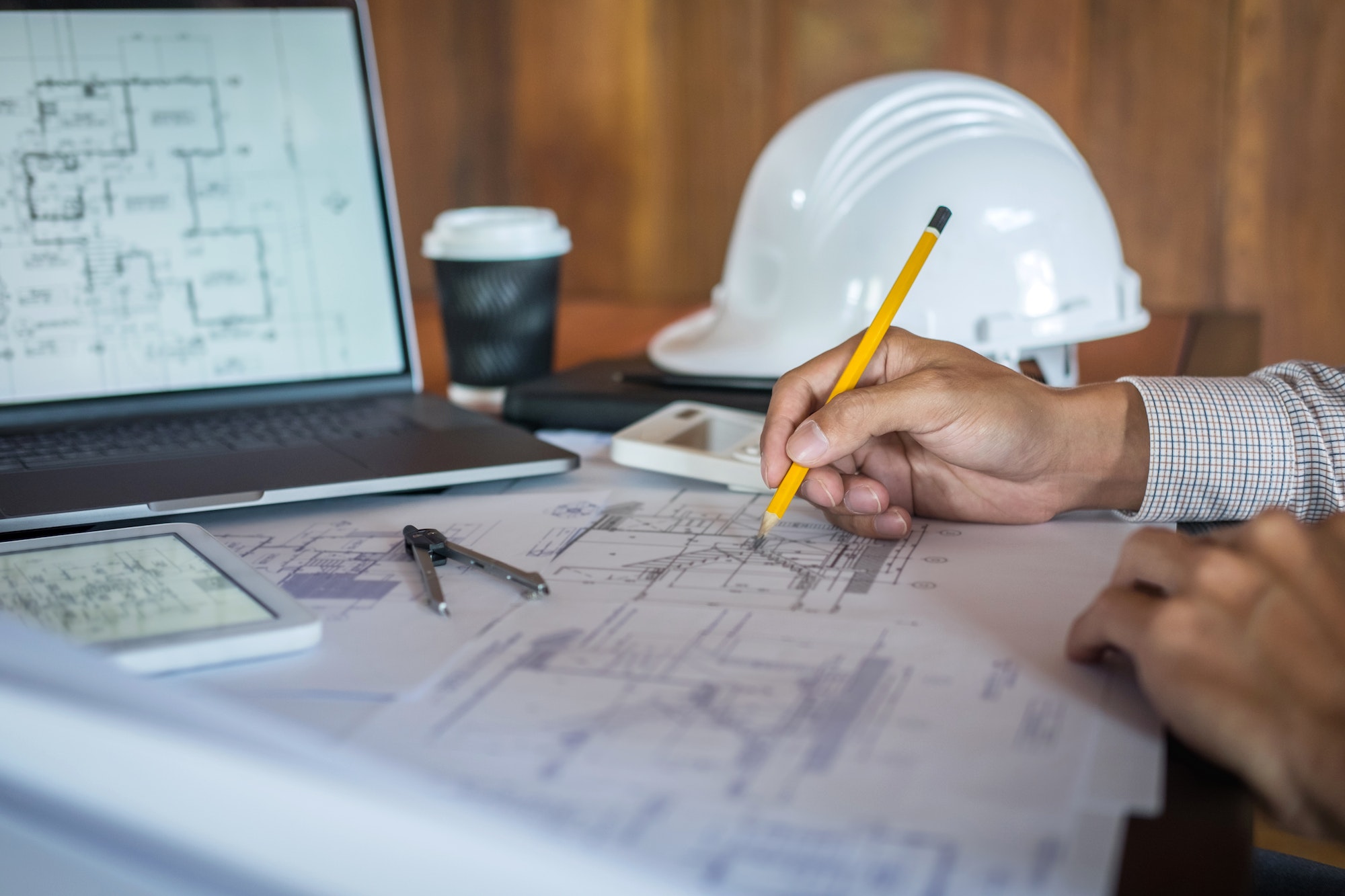 Construction engineering or architect hands working on blueprint inspection in workplace